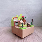 Manual music box made of beech wood with forest train motif