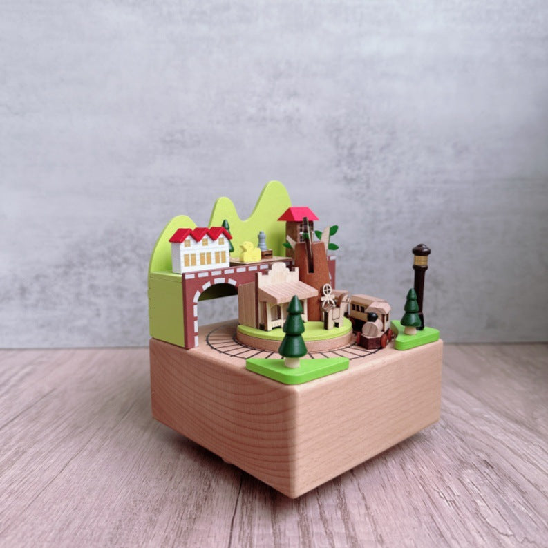 Manual music box made of beech wood with forest train motif