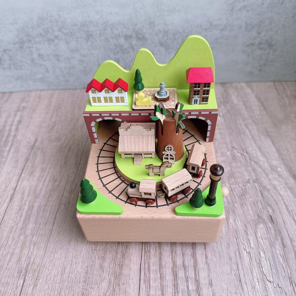 Manual music box made of beech wood with forest train motif