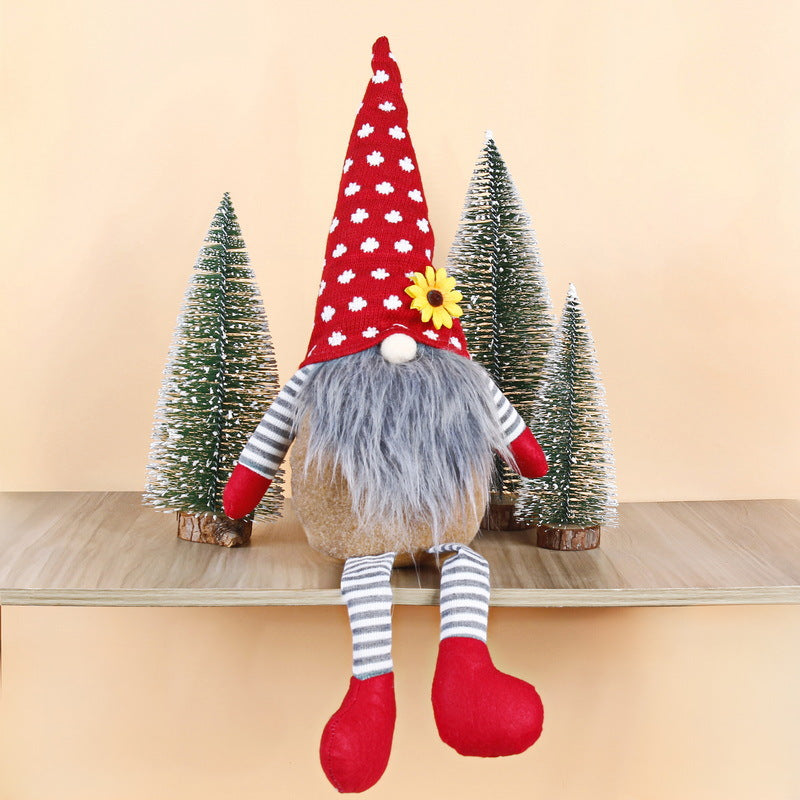 Christmas elf figure with long legs, sitting