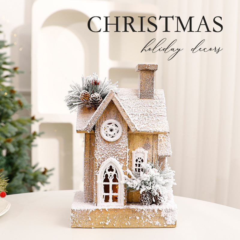 Illuminated Christmas Wooden House with Snow Landscape