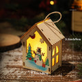 Illuminated wooden Christmas house for table decoration