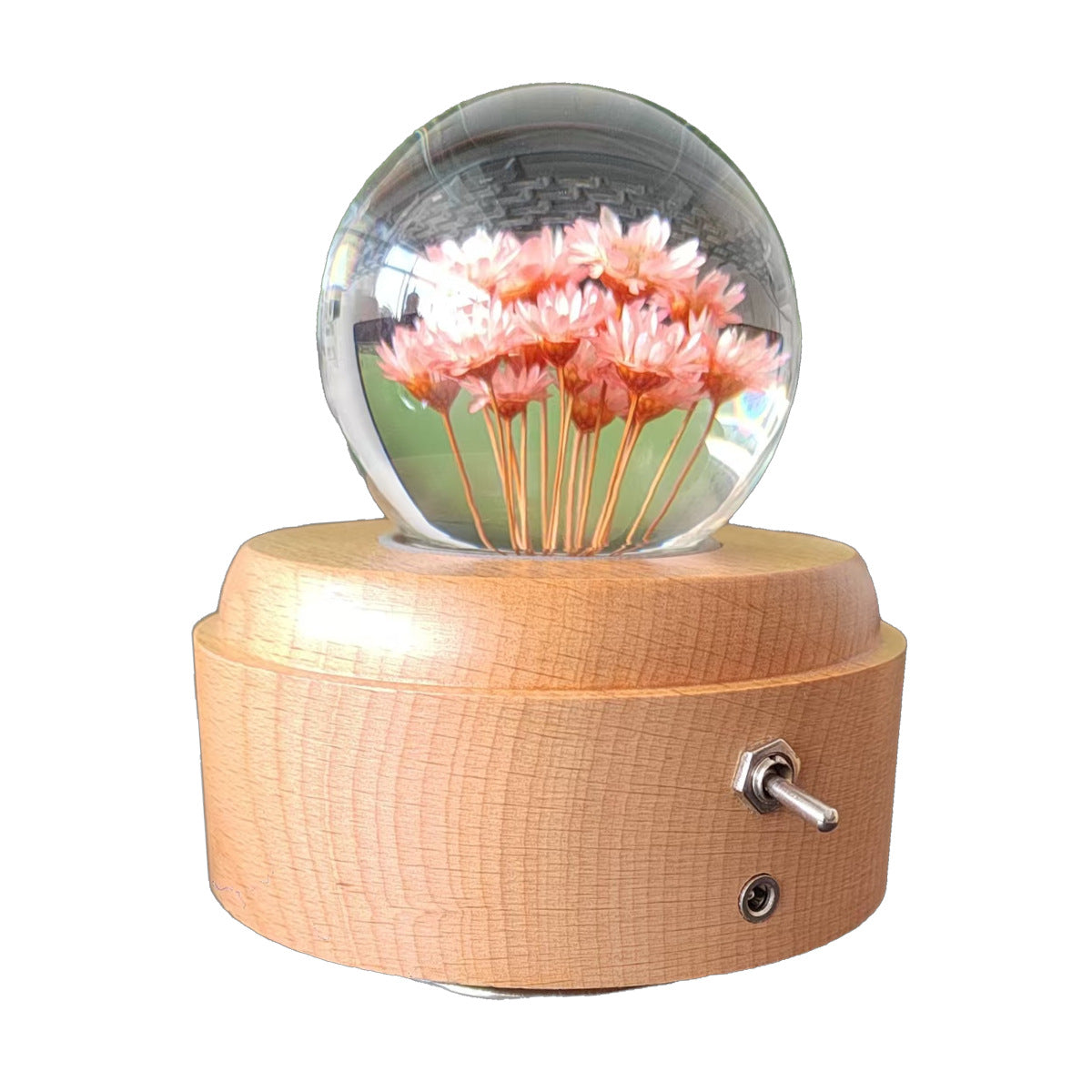 Crystal ball music box with rotating base and dried flowers