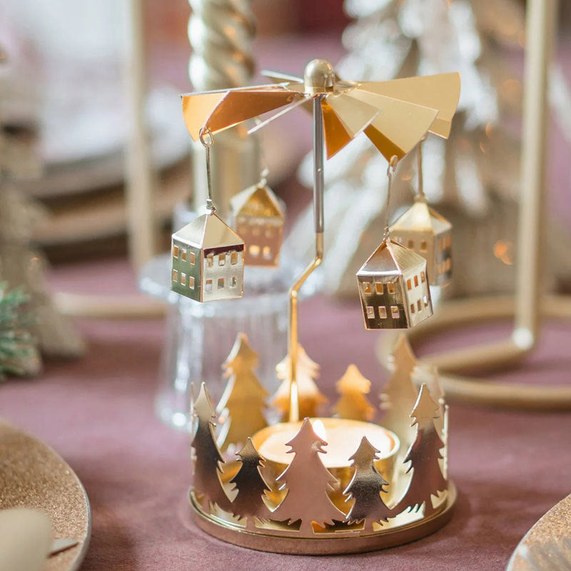 Rotating tea light holder made of brass with star motif