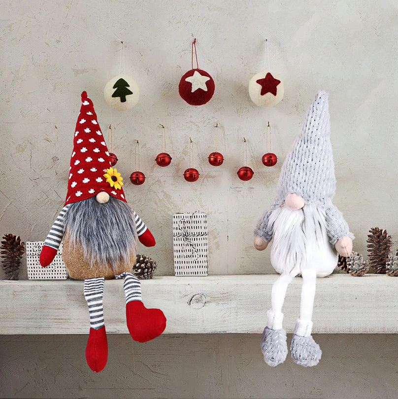 Christmas elf figure with long legs, sitting