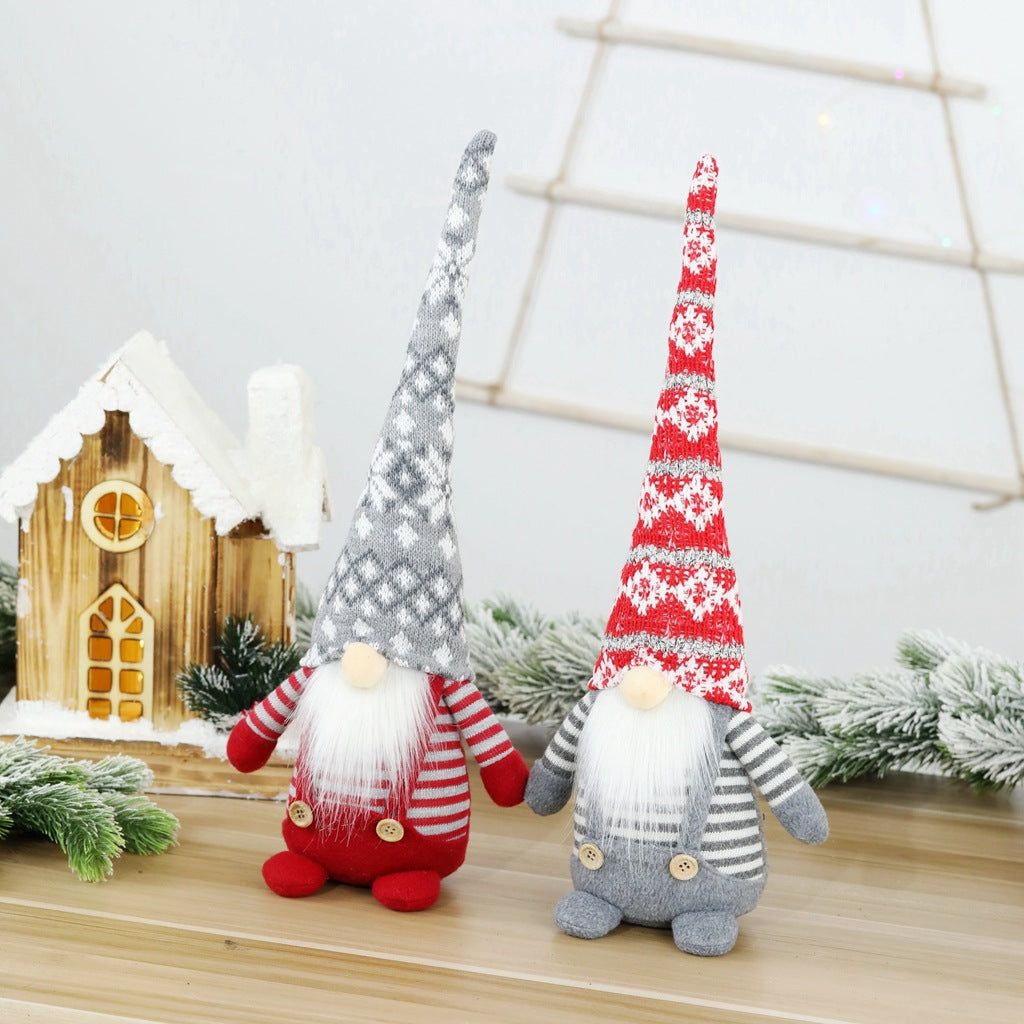 Christmas elf figure with knitted hat, sitting