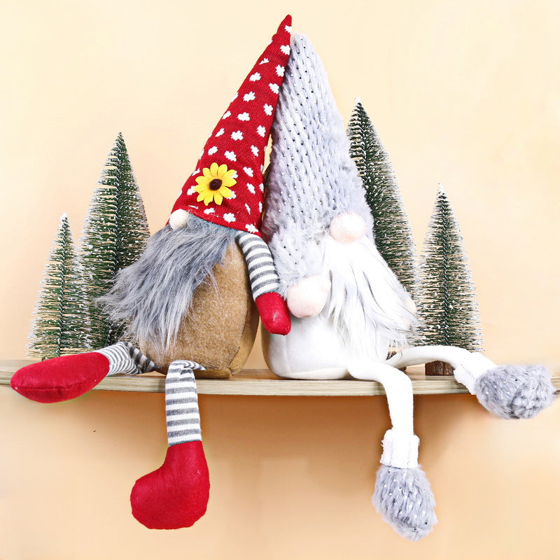 Christmas elf figure with long legs, sitting