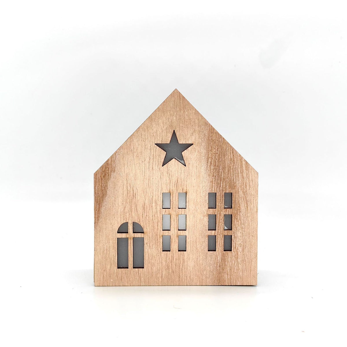 Christmas wooden house with lighting as table decoration