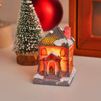 Illuminated Christmas cottage made of resin