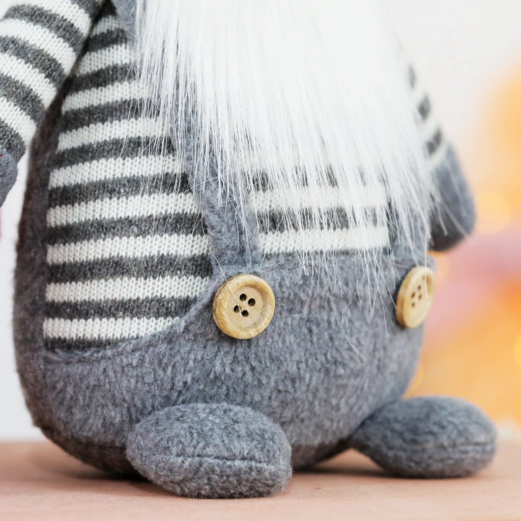 Christmas elf figure with knitted hat, sitting