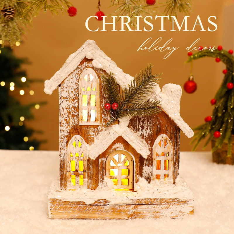 Illuminated Christmas Wooden House with Snow Landscape