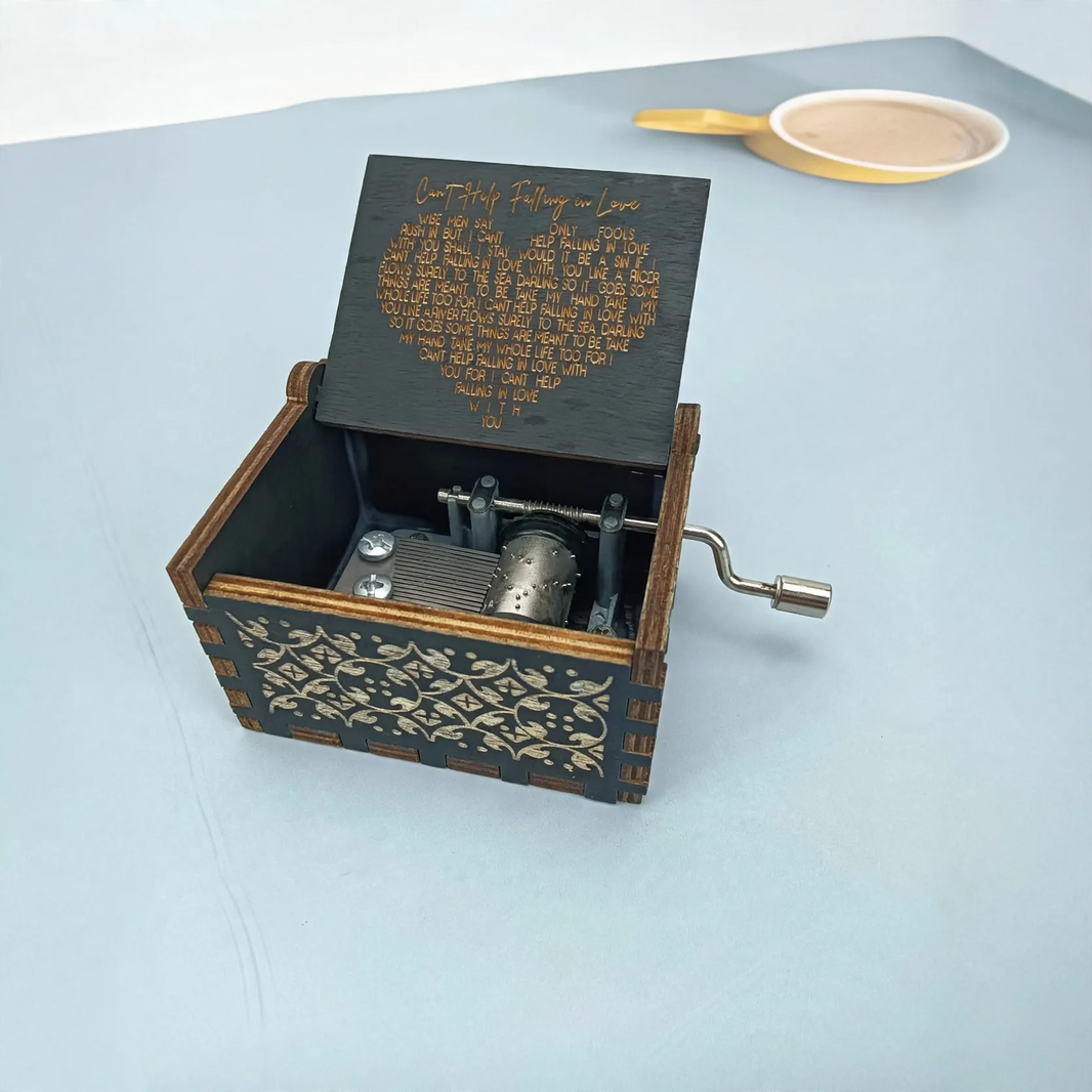 Hand-crank music box made of wood with laser engraving