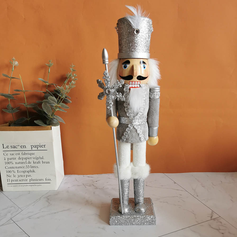 Decorative nutcracker figure made of wood with snowflake design