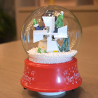 Christmas music box with snow globe effect