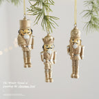 Golden nutcracker pendant made of resin for the Christmas tree