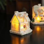 Illuminated miniature snow house made of resin