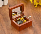 Wooden music box with hand crank