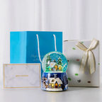 Musical snow globe music box with snow hut