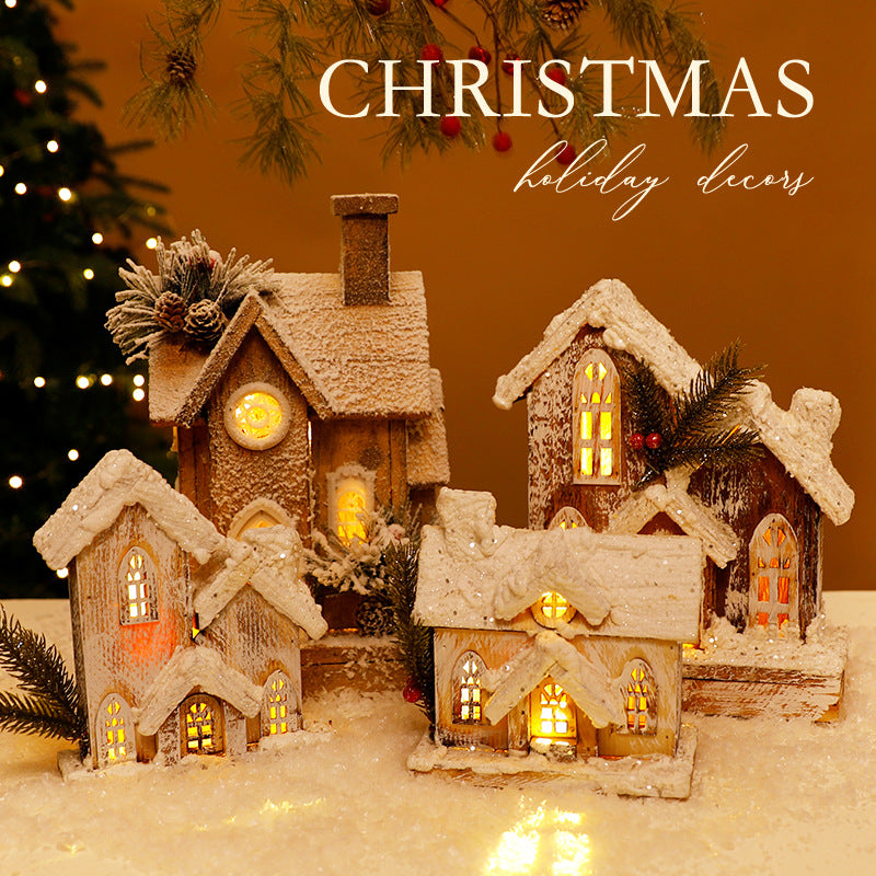 Illuminated Christmas Wooden House with Snow Landscape