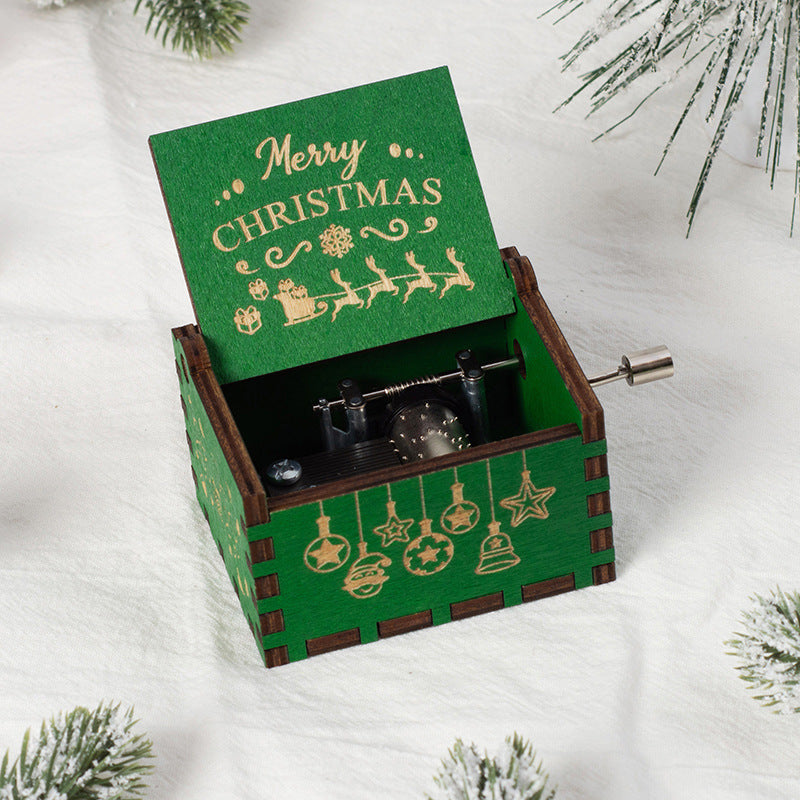 Manual wooden music box with crank