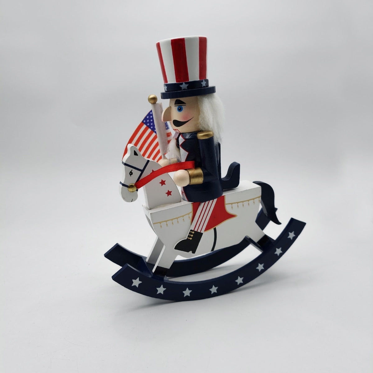 Nutcracker figure on rocking horse, 26 cm