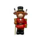 Decorative nutcracker and highland cattle figures made of resin