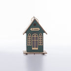Illuminated wooden house for Christmas decoration