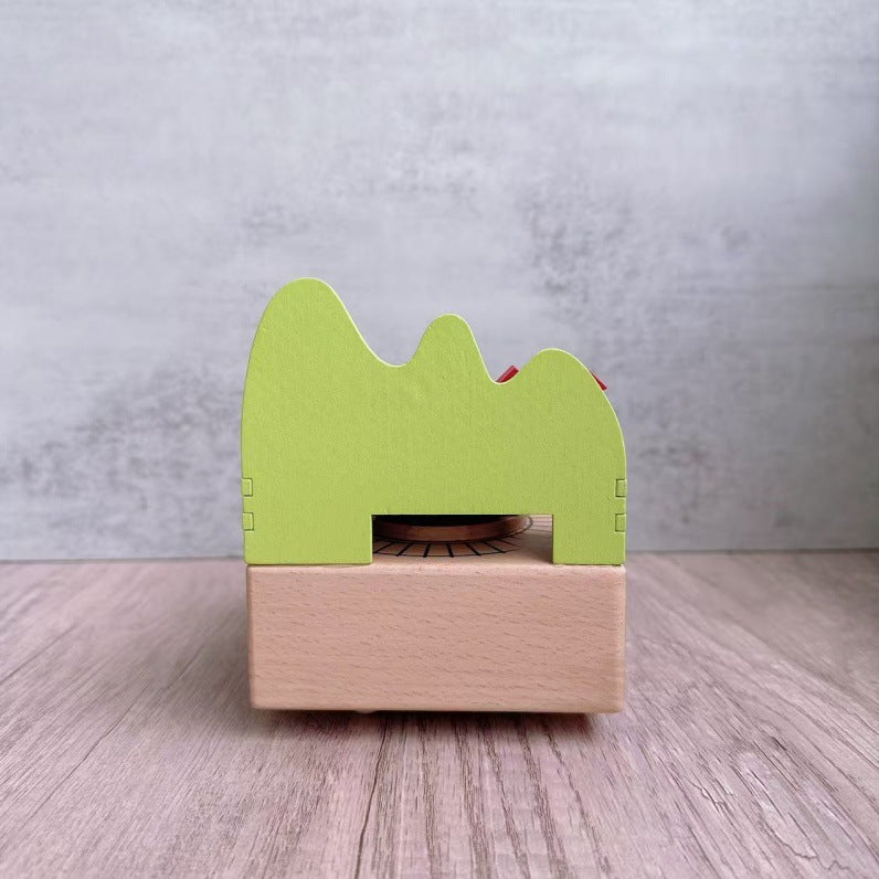 Manual music box made of beech wood with forest train motif