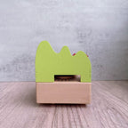Manual music box made of beech wood with forest train motif