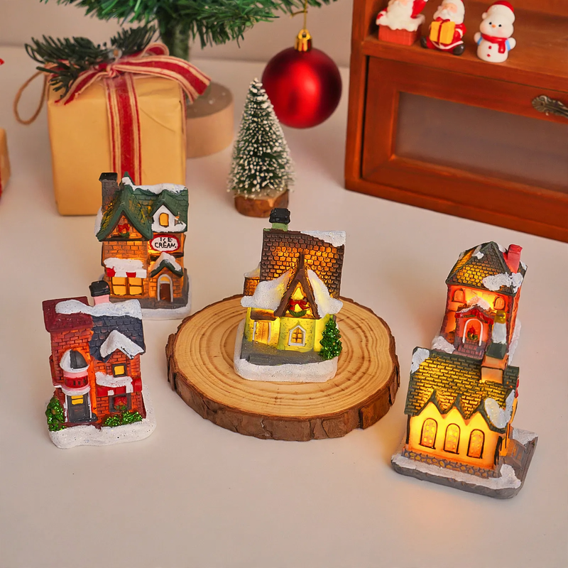 Illuminated Christmas cottage made of resin