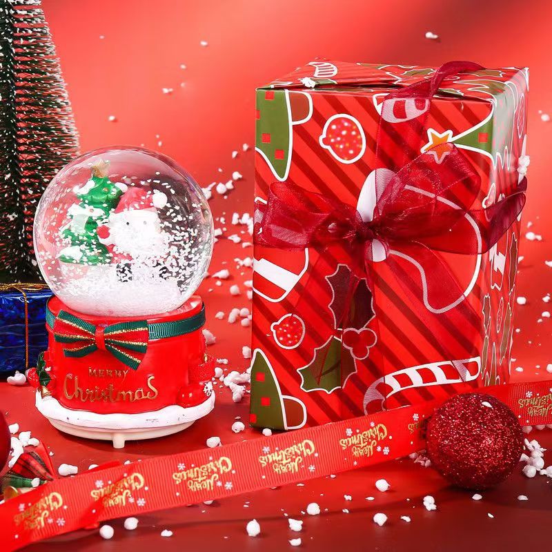 Illuminated snow globe music box with music