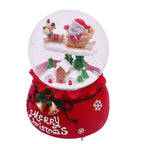 Illuminated snow globe music box with music