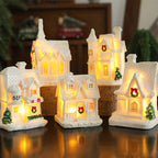 Illuminated miniature snow house made of resin