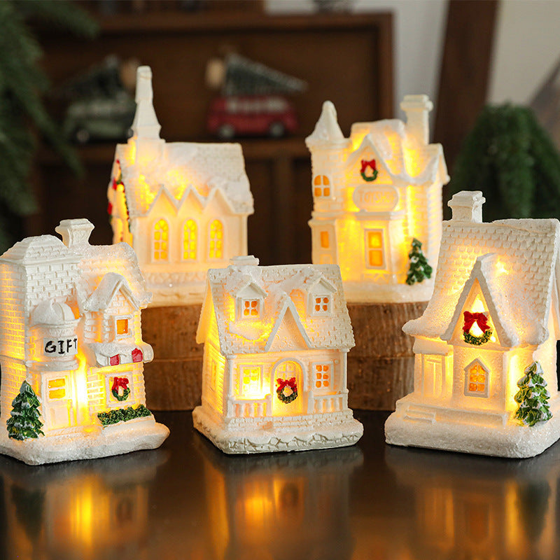 Illuminated miniature snow house made of resin