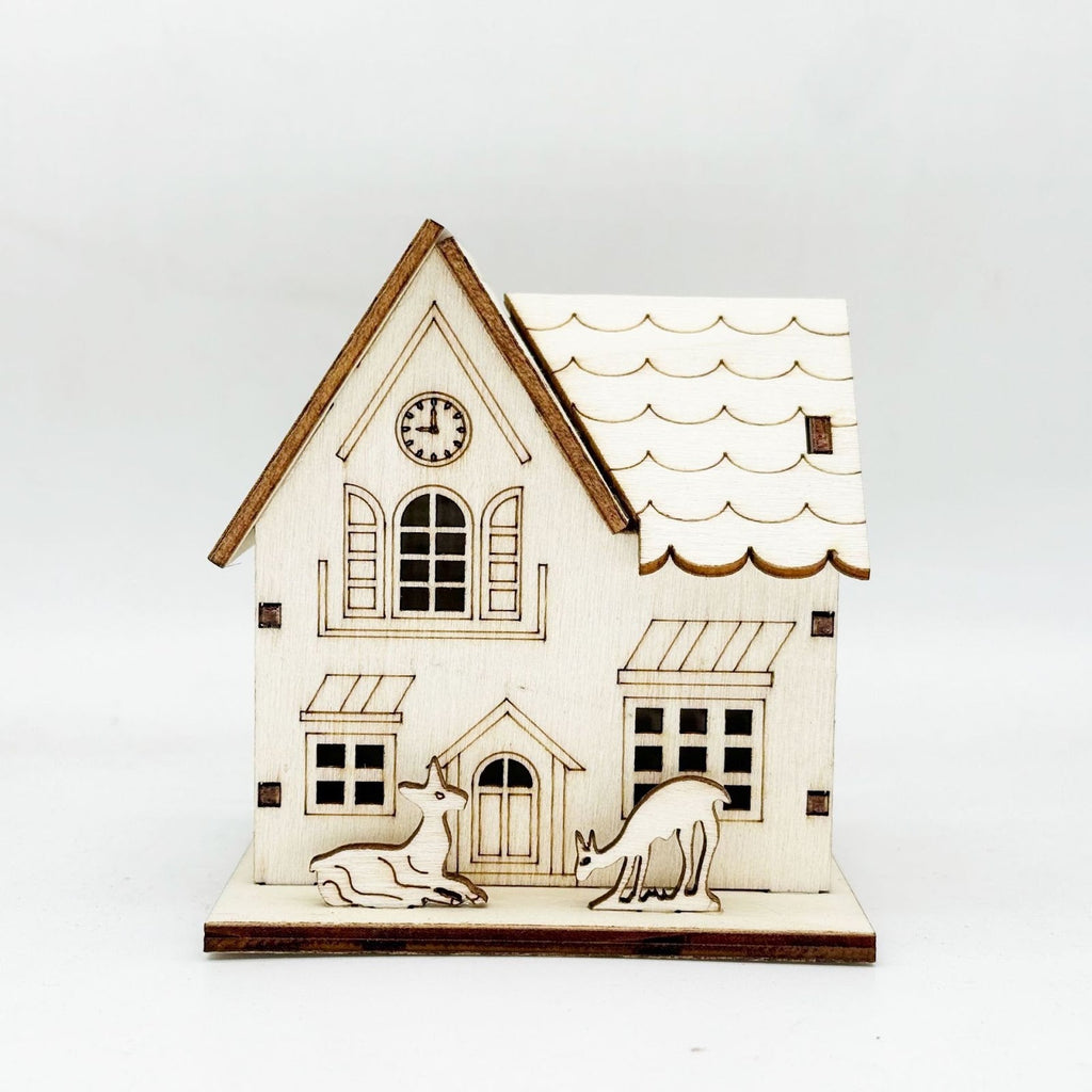 Illuminated wooden house for Christmas decoration