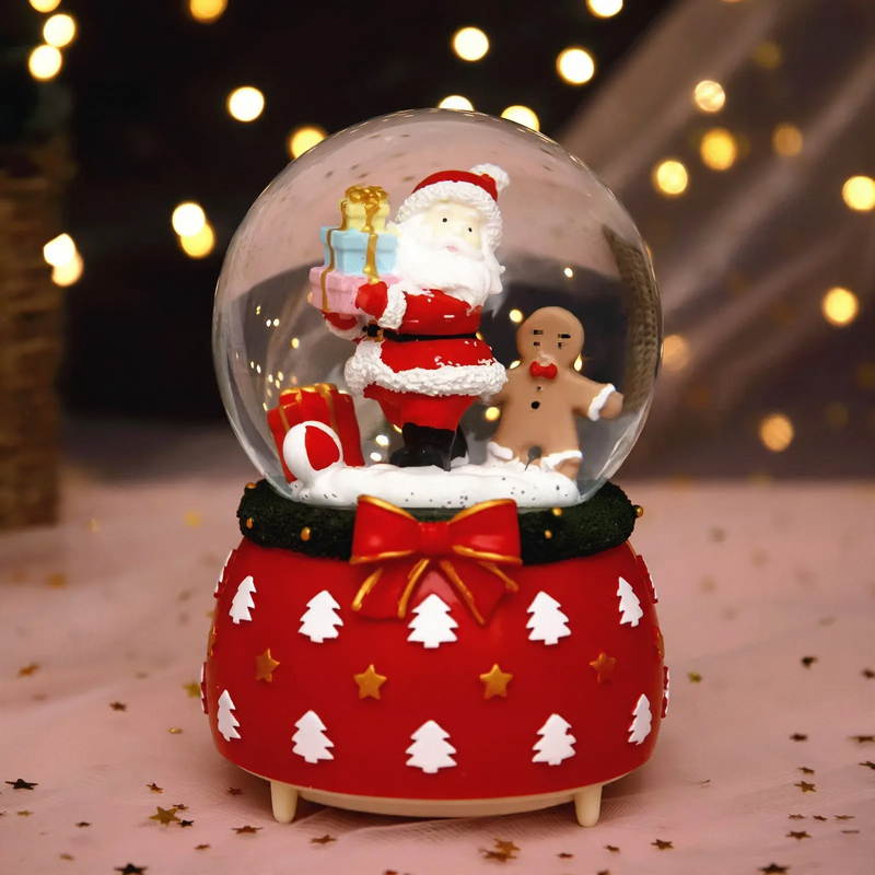 Illuminated snow globe music box with music