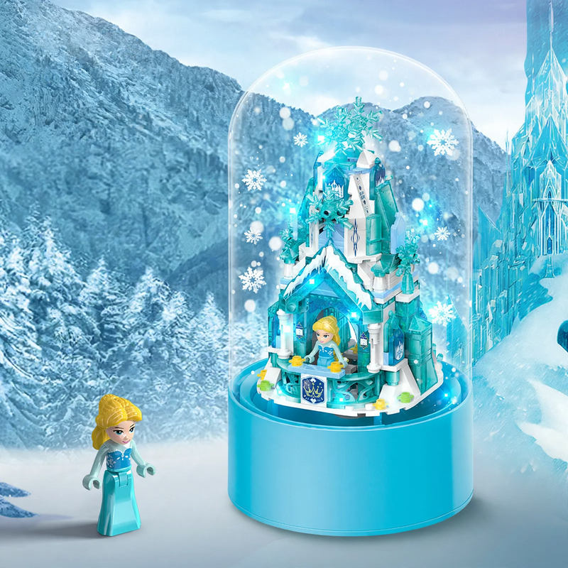 Rotating music box with light and snowfall