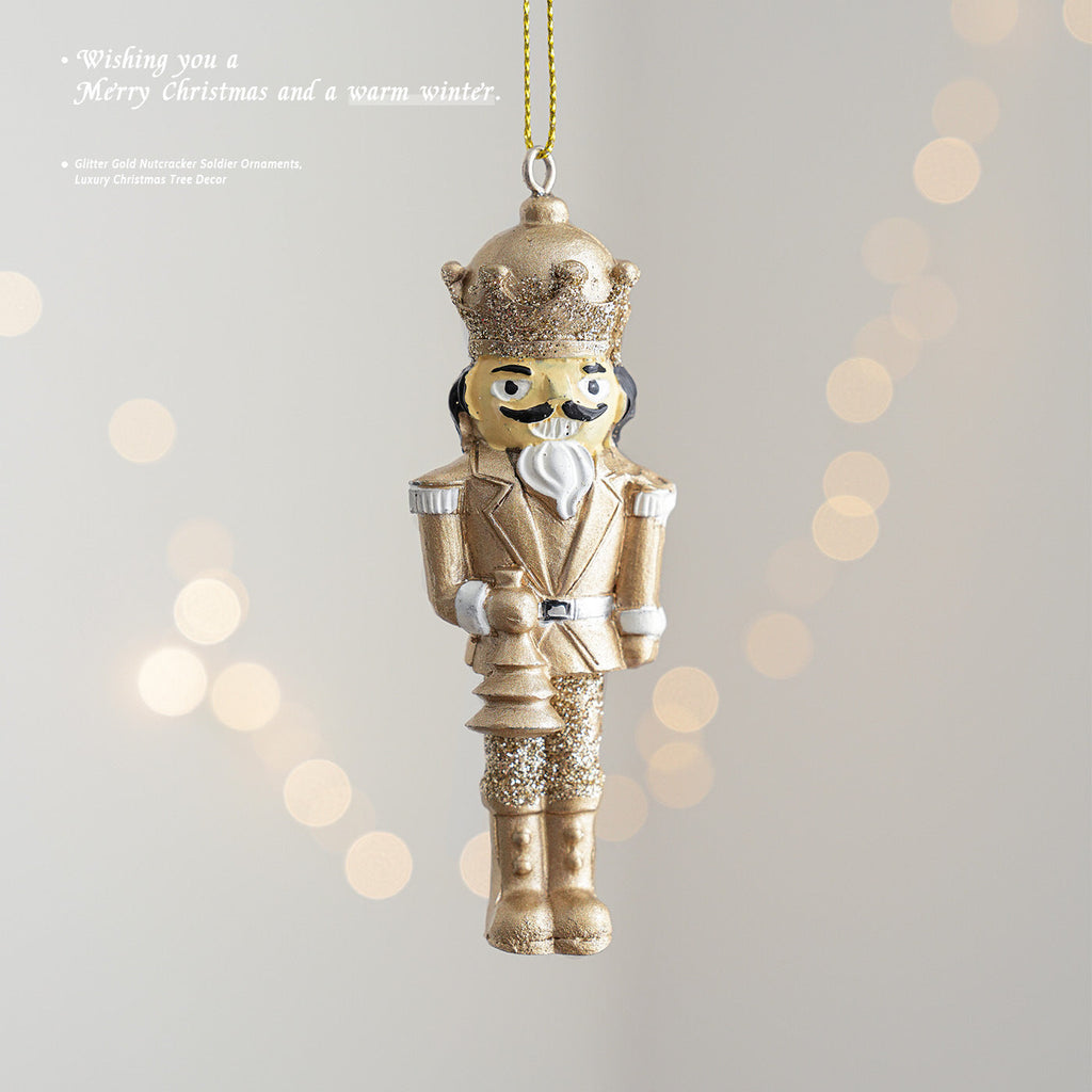 Golden nutcracker pendant made of resin for the Christmas tree