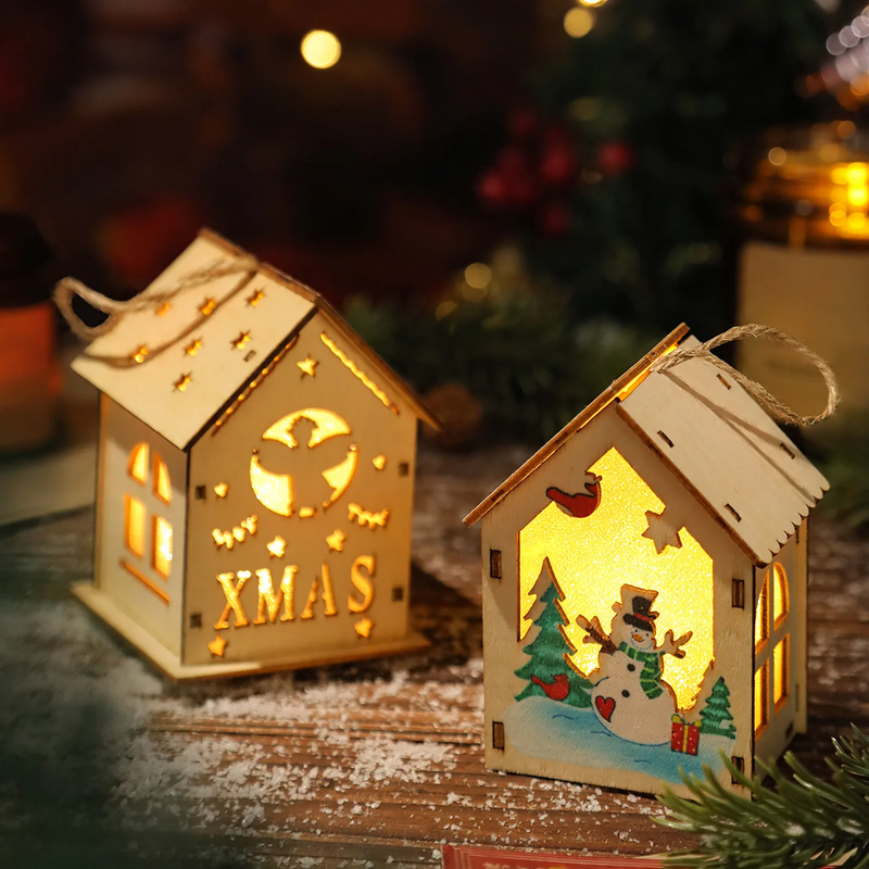 Illuminated wooden Christmas house for table decoration