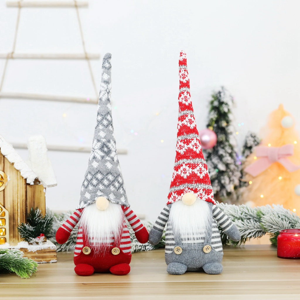Christmas elf figure with knitted hat, sitting