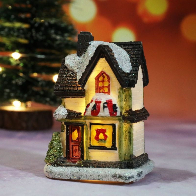 Illuminated Christmas house made of resin
