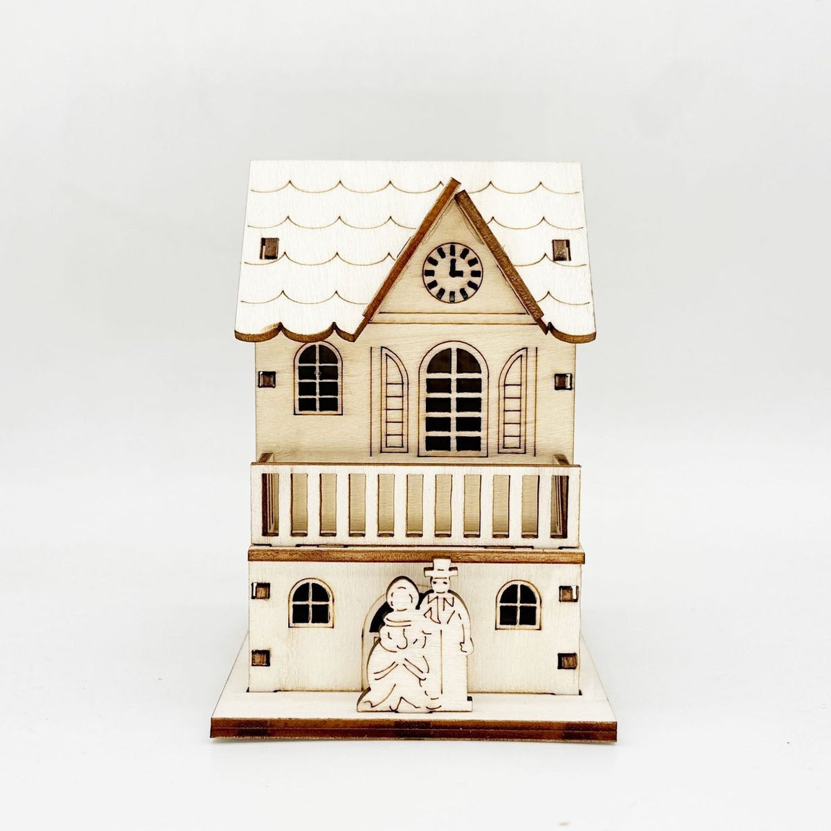 Illuminated wooden house for Christmas decoration