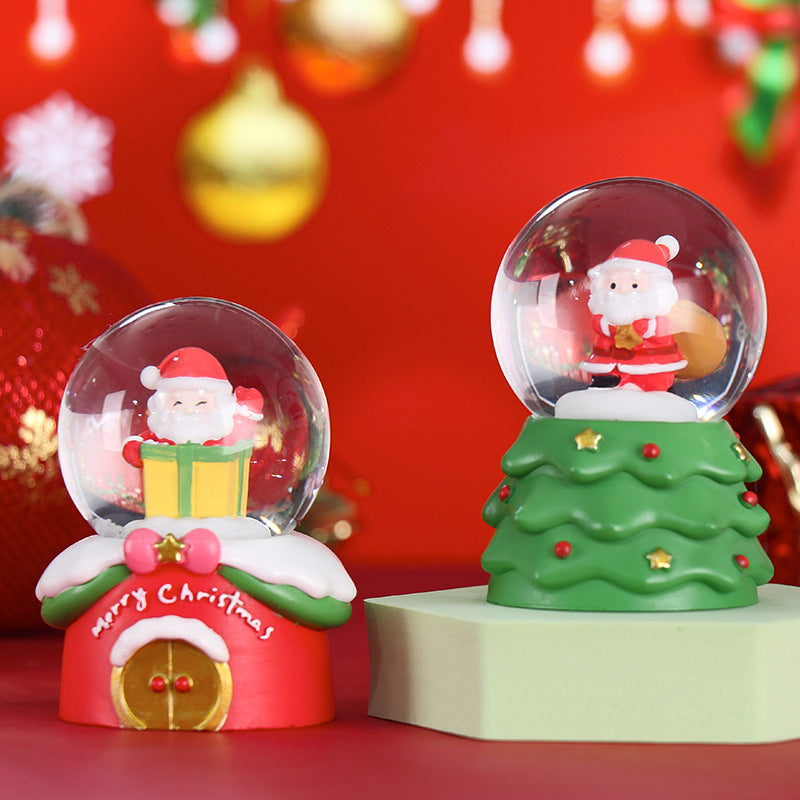 Glowing snow globe with Christmas motifs