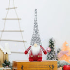 Christmas elf figure with knitted hat, sitting