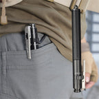 Compact telescoping stick clipped to a pants pocket